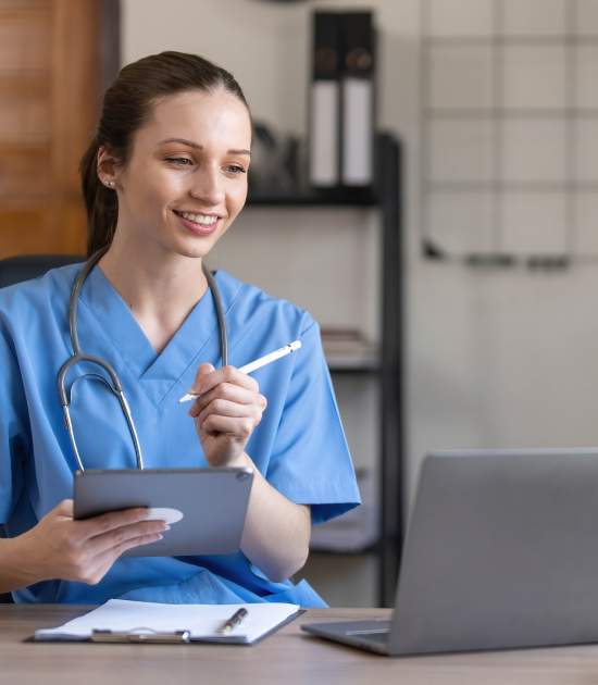 medical professional working on a lapto