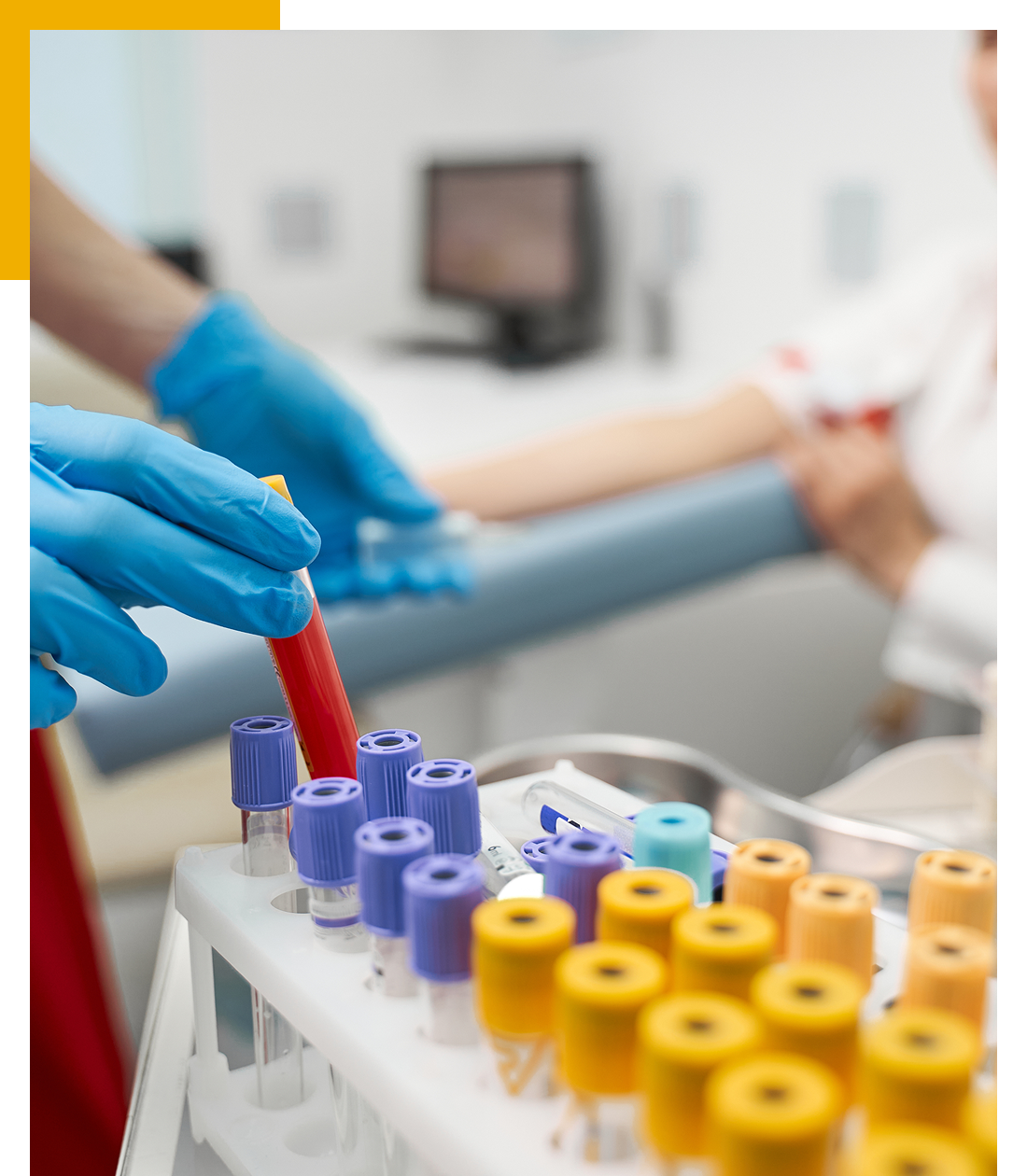 medical professional handling blood samples in a tray